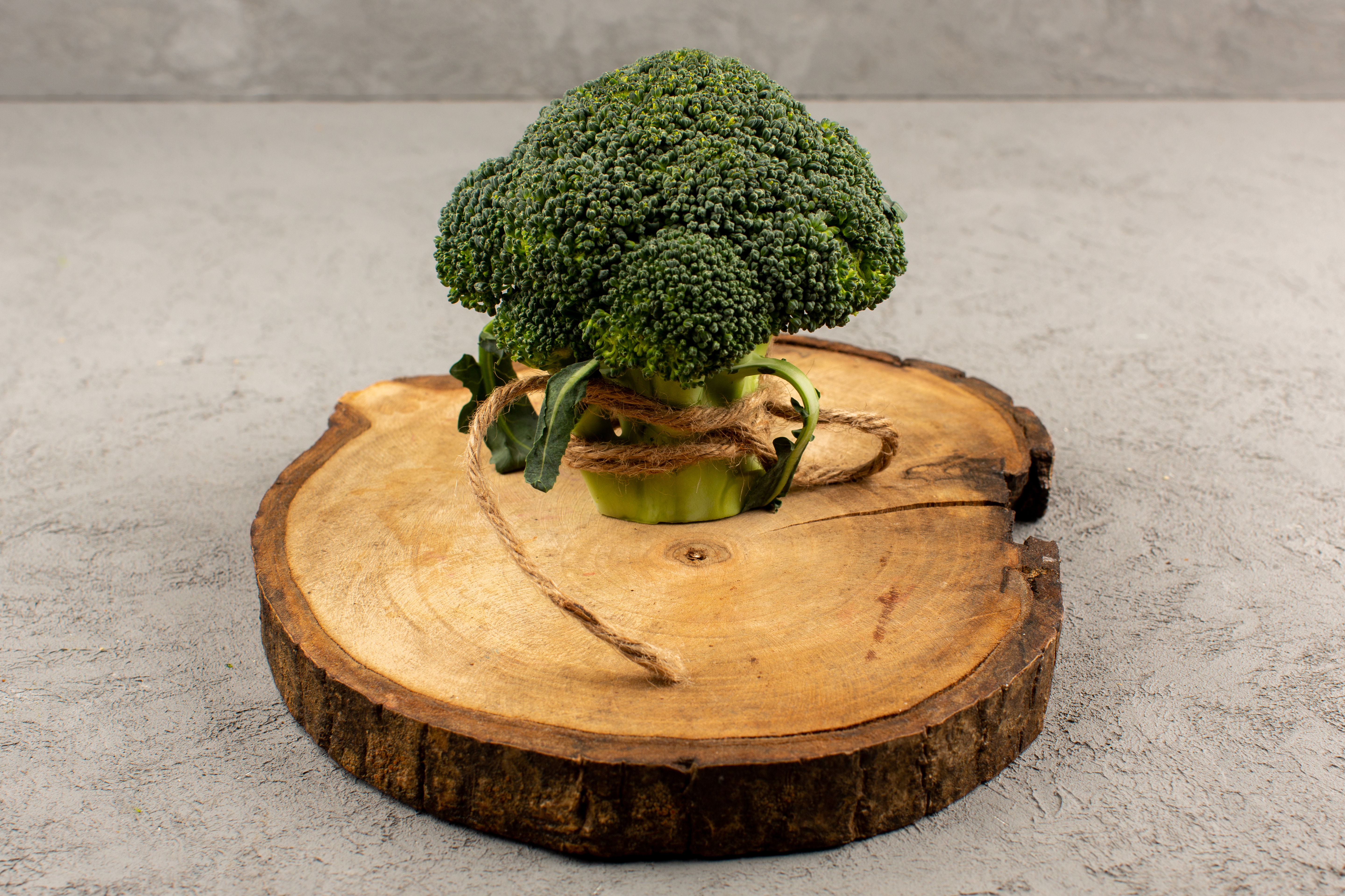 a top view green broccoli fresh on the grey background