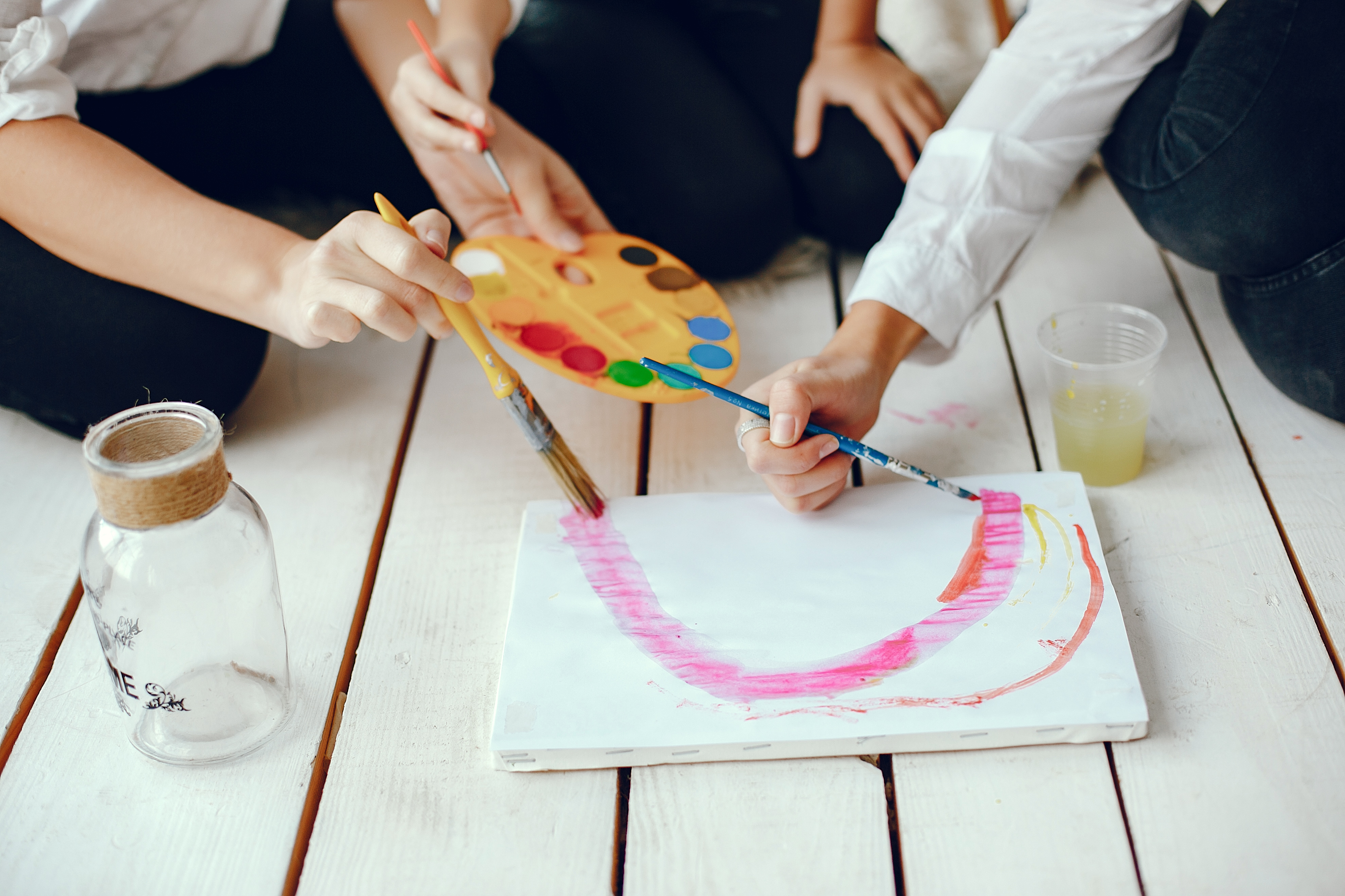 Beautiful mom and daughter are drawing