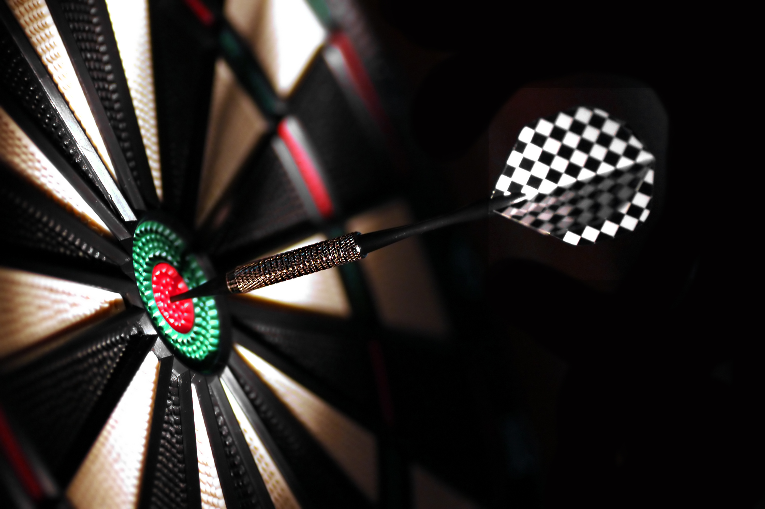 One arrow in the centre of a dart board